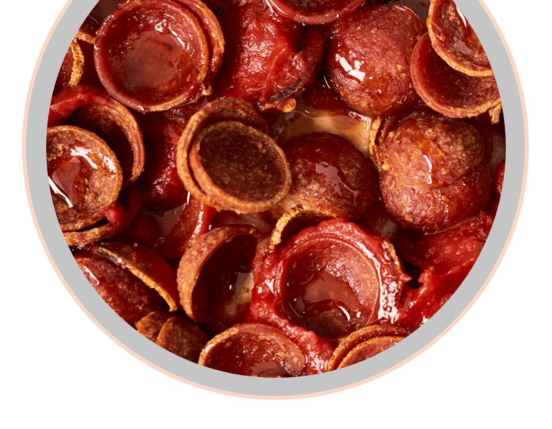 close up of cup and char pepperoni