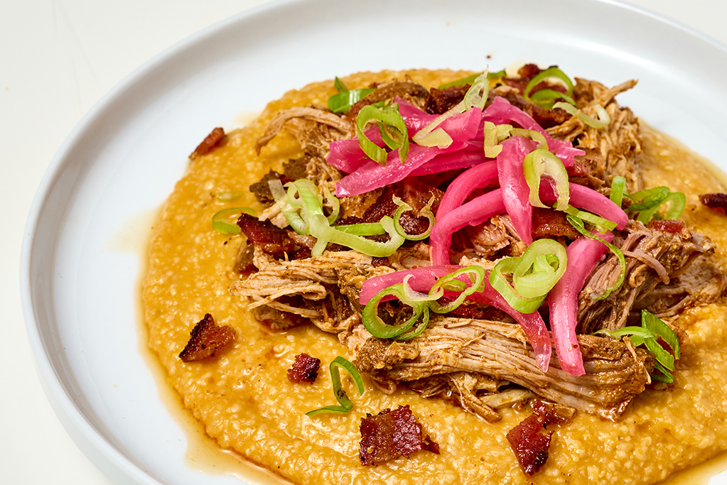 Close up of barbacoa with jalapeno bacon and grits