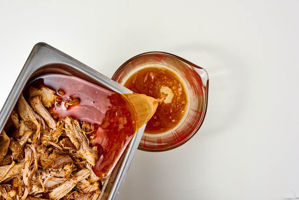 Draining grease into a glass measuring cup