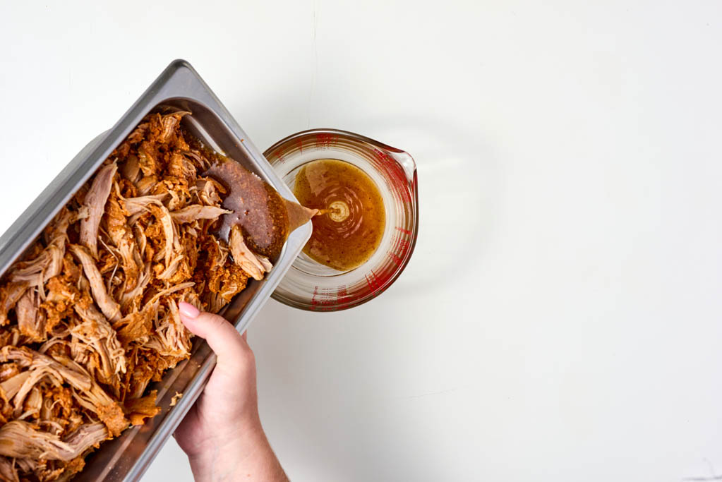 Draining grease into glass measuring cup