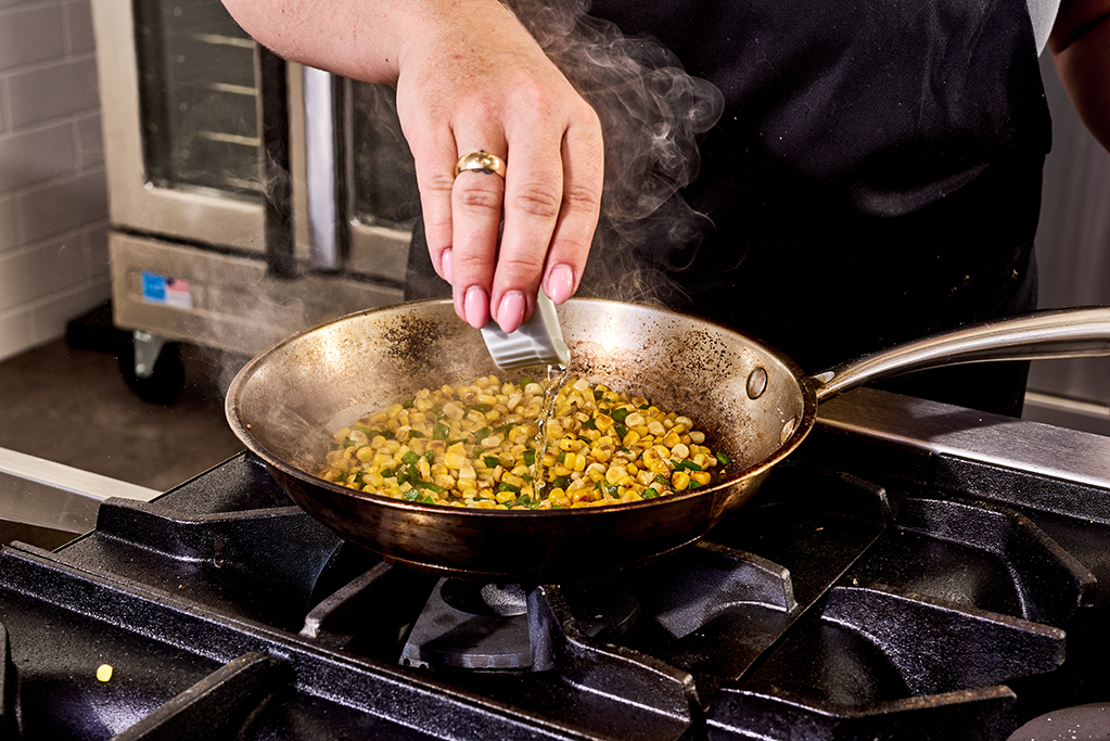 Pouring ingredients into pan