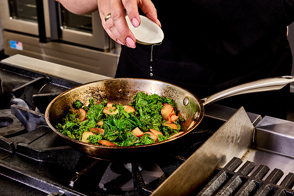 Heating ingredients in a pan over the stove