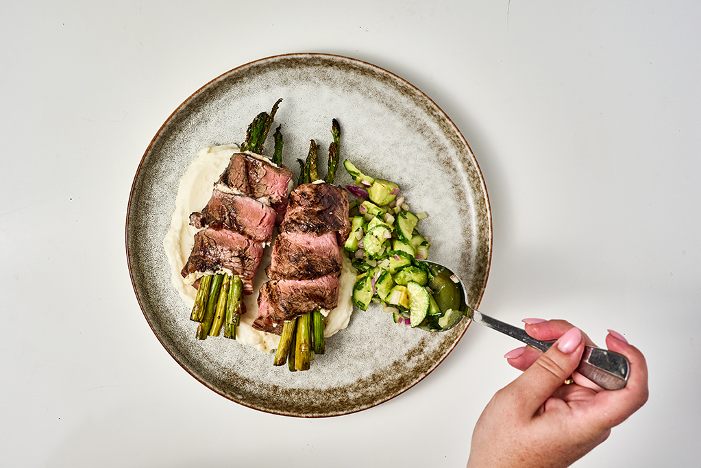 Plating steak-wrapped asparagus