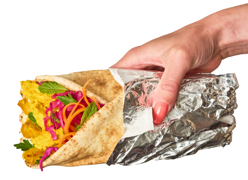 a hand holding a turkey wrap