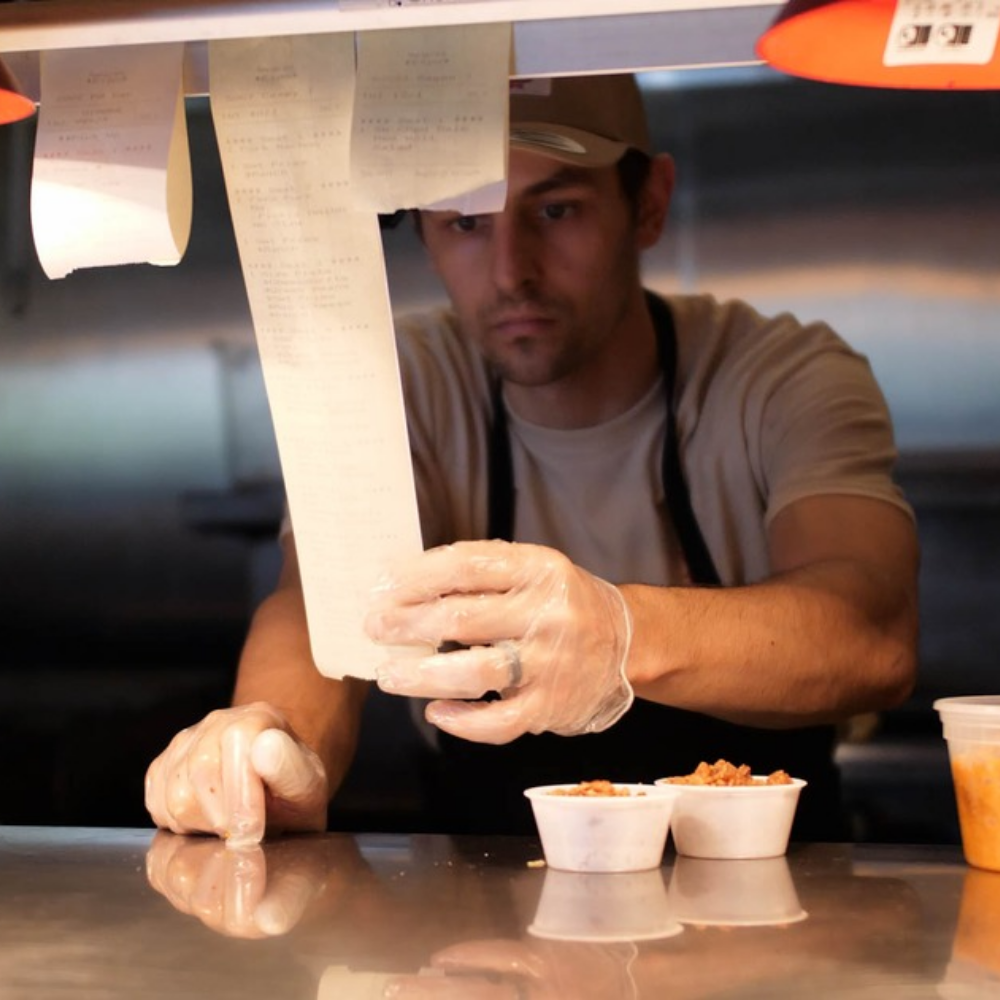 Cook looking at an order in the kitchen